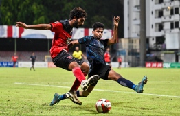A player of Super United Sports attempting to block an attack from TC Sports Club during the U19 Youth Championships 2024 finals. -- Photo: Fayaz Moosa / Mihaaru News
