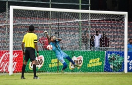 Goalkeeper of TC Sports Club defending the goal from a ball sent in by Super United Sports during the penalty shootout of the U19 Youth Championships 2024 finals. -- Photo: Fayaz Moosa / Mihaaru News