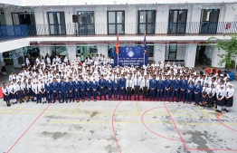 President Dr Mohamed Muizzu taking a group photo with students of Higher Secondary Education (CHSE) after attending the special assembly held at the school to commemorate their 45th anniversary. -- Photo: President's Office