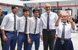 Students of Centre for Higher Secondary Education (CHSE) taking selfies with President Dr Mohamed Muizzu upon his arrival to the special assembly held at the school to commemorate their 45th anniversary. -- Photo: President's Office