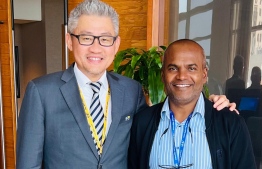 [File[ Former General Secretary of FAM, Shah Ismail (R) with a foreign official.