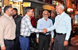 Parliamentary Group (PG) Leader of People's National Congress (PNC), Ibrahim Falah shaking hands with President Dr Mohamed Muizzu upon his arrival at the 'Haruge Ceremony' held at PNC House last night. -- Photo: Fayaz Moosa / Mihaaru News