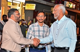 Minister of Defence, Mohamed Ghassan Maumoon shaking hands with President Dr Mohamed Muizzu upon his arrival at the 'Haruge Ceremony' held at People's National Congress (PNC) House last night. -- Photo: Fayaz Moosa / Mihaaru News