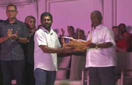 The traditional dance group of Kamadhoo receiving a special gift on behalf of Moosa.