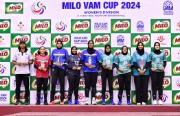 Title winning players of the VAM Cup alongside the best coach posing for a picture with their plagues. -- Photo: Fayaz Moosa / Mihaaru News