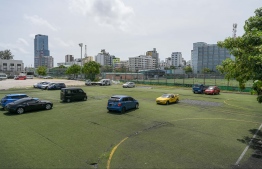 Cars using the now deserted and derelict Mini FAM Turf Ground established through AFC's aid as a parking zone. FAM has not initiated any renovation attempts on the pitch since its deterioration. -- Photo: Nishan Ali / Mihaaru News