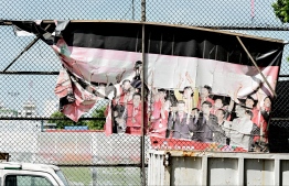 Canvases affixed on billboards, displaying the success and triumph of Maldives' National Football Team now torn and discolored. -- Photo: Nishan Ali / Mihaaru News