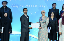 Minister of Higher Education, Labour and Skills Development Dr Maryam Mariya presents scholarship awarding letter.-- Photo: Nishan Ali / Mihaaru