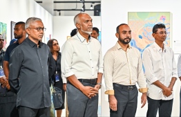 President Dr Mohamed Muizzu at the art exhibition 'Unveiling Visions 2024' with Minister of Youth Empowerment, Information and Art, Ibrahim Waheed to see the featured artworks of local artists. -- Photo: Fayaz Moosa / Mihaaru News