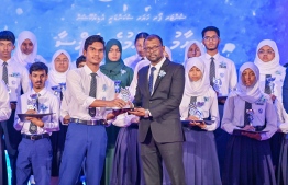 A student who secured a top rank in their academics at the Centre for Higher Secondary Education's (CHSE) receiving their award at the school's annual Prize Day ceremony held on Monday night. -- Photo: President's Office