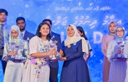 A student who secured a top rank in their academics at the Centre for Higher Secondary Education's (CHSE) receiving their award at the school's annual Prize Day ceremony held on Monday night. -- Photo: President's Office