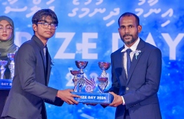 A student who secured a top rank in their academics at the Centre for Higher Secondary Education's (CHSE) receiving their award at the school's annual Prize Day ceremony held on Monday night. -- Photo: President's Office