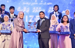 A student who secured a top rank in their academics at the Centre for Higher Secondary Education's (CHSE) receiving their award at the school's annual Prize Day ceremony held on Monday night. -- Photo: President's Office