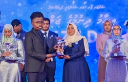 A student who secured a top rank in their academics at the Centre for Higher Secondary Education's (CHSE) receiving their award at the school's annual Prize Day ceremony held on Monday night. -- Photo: President's Office