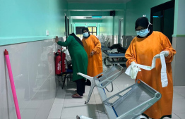 Employees cleaning the Vilimale' Hospital.