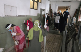 Employees cleaning the IGMH Hospital.