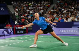 Estonia's Kristin Kuuba plays a shot to Maldives' Fathimath Nabaaha Abdul Razzaq in their women's singles badminton group stage match during the Paris 2024 Olympic Games at Porte de la Chapelle Arena in Paris on July 30, 2024. (Photo by Arun SANKAR / AFP)