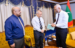 President Muizzu with Fuad Thaufeeq and Journalist Saail who authored the biography -- Photo: President's Office