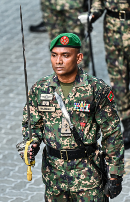 An MNDF officer marching in the parade held yesterday to commemorate Maldives' Independence Day. -- Photo: Fayaz Moosa / Mihaaru News