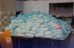 Bags of rice stacked on a surface in the premises where expatriates prepared food -- Photo: Immigration