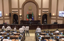 Opposition MDP members protest in the parliament chamber following discontent with Minister Haidar's answers