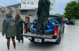 MNDF deployed to drain water from a flooded island -- Photo: NDMA