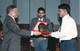 Former President Maumoon Abdul Gayoom presents Zahir with National Award for Public Service for economic development in 1993 -- Photo: President's Office