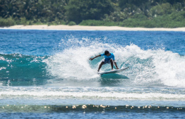 Aspiring local surfer, Sayyid Salahuddin riding the waves.