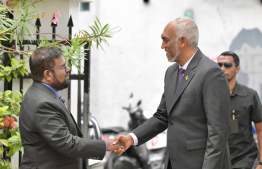 President Dr Mohamed Muizzu exchanging greetings with Mahmood Shaugy, the Chancellor of Maldives National University (MNU) at the Theveli International Conference 2024. -- Photo: President's Office