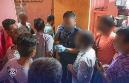 Expats detained during the raid -- Photo: Immigration