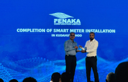 Fenaka MD Muaz and Environment Minister Thoriq (L-R) at the ceremony held to mark the conclusion of the smart meter installation project in all homes in Dh. Kudahuvadhoo.