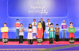 President Dr Mohamed Muizzu posing for a photo with school students during the High Achievers Award Ceremony held today. -- Photo: Nishan Ali / Mihaaru News