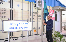 CEO of Maldives Ports Limited (MPL) Mohamed Wajeeh Ibrahim raising the flag of the Uthuru (North) ISPS Gateway Project which will oversee all administrative procedures of the project. -- Photo: Nishan Ali / Mihaaru News