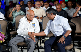 Retired Magistrate Idhrees Adam and Managing Director of STO Ahmed Shimadh exchanging a handshake during the special ceremony held at Haa Alif atoll Uligan to inaugurate the headquarters of the Uthuru (North) ISPS Gateway Project. -- Photo: Nishan Ali / Mihaaru News