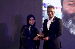 The award being accepted by Saeed's daughter