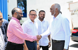 President Dr. Mohamed Muizzu being greeted by Islamic Minister Mohamed Shaheem Ali Saeed after arriving at the opening ceremony of Aa Sahara Mosque and attached funeral home -- Photo: President's Office