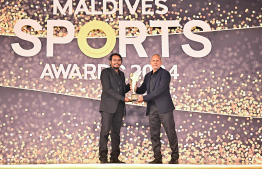 Best carom player award being handed over to Ismail Azmeen. He won the national carom championship three years in a row -- Photo: Fayaz Moosa | Mihaaru