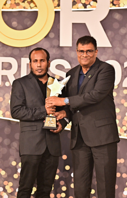 Abdul Razzaq Abdul Samad being awarded for his accomplishments. He secured a medal at the Paraolympics -- Photo: Fayaz Moosa | Mihaaru