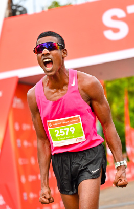 Hussain Fazeel, who holds multiple running records in the Maldives celebrating after his race at the Dhiraagu Maldives Road Race. Fazeel first started running at the 2013 Dhiraagu Road Race -- Photo: Nishan |Mihaaru