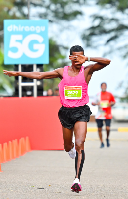 Hussain Fazeel, who holds multiple running records in the Maldives celebrating after his race at the Dhiraagu Maldives Road Race. Fazeel first started running at the 2013 Dhiraagu Road Race -- Photo: Nishan |Mihaaru