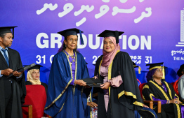 A graduate receiving their certificate. A total of 311 students graduated from MNU this year -- Photo: President's Office