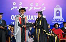 A graduate receiving their certificate. A total of 311 students graduated from MNU this year -- Photo: President's Office