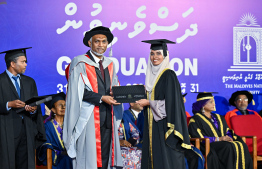 A graduate receiving their certificate. A total of 311 students graduated from MNU this year -- Photo: President's Office