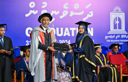 A graduate receiving their certificate. A total of 311 students graduated from MNU this year -- Photo: President's Office