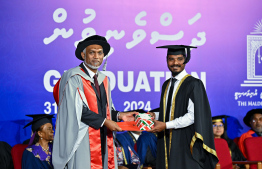 A graduate receiving their certificate. A total of 311 students graduated from MNU this year -- Photo: President's Office