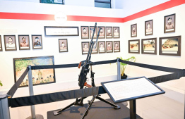 One of the displays, of a weapon used in defence during the November 3 insurgence, at the Victory Day Exhibition.-- Photo: President's Office