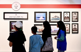 People view some of the exhibits displayed at MNDF's dedicated exhibition opened to commemorate Victory Day -- Photo: Nishan Ali