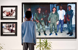 People view some of the exhibits displayed at MNDF's dedicated exhibition opened to commemorate Victory Day -- Photo: Nishan Ali