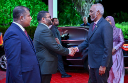 President Dr Mohamed Muizzu being greeted by Defence Minister Mohamed Ghassan Maumoon as Ministry of Dhivehi Language, Culture and Heritage Adam Naseer stands by.-- Photo: President's Office