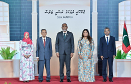 President Dr. Mohamed Muizzu posing for a photo with Dr. Mohamed Zahir Hussain and some of his family members after conferring the highest Civilian Award, the Order of the Distinguished Rule of Izzuddin (ODRI) to Dr Mohamed Zahir Hussain for his exemplary services and contributions to the development of education in Maldives -- Photo: President's Office